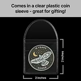 Photo of a round sobriety coin with a soaring hawk design inside a clear plastic sleeve with size dimensions marked